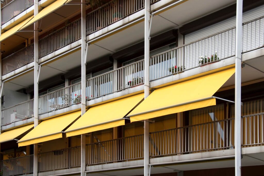 An apartment building equipped with awnings